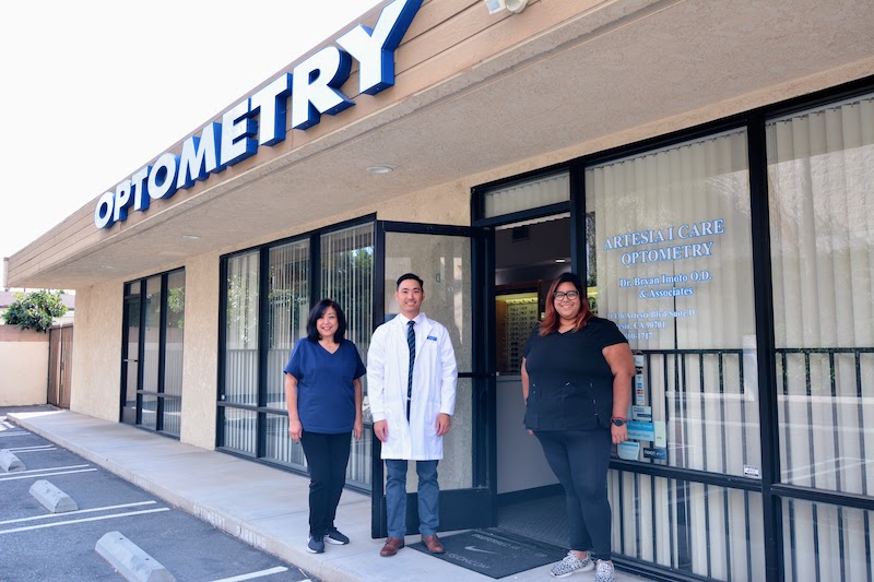 Exterior photo of Artesia I Care Optometry with the team