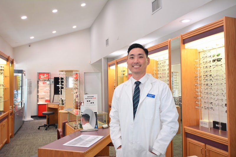 Dr. Imoto standing in the lobby of Artesia I Care Optometry